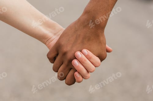 Preview: Multiethnic best friends holding hands tenderly
