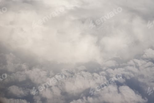 Preview: White fluffy clouds top view from the airplane window. Abstract background