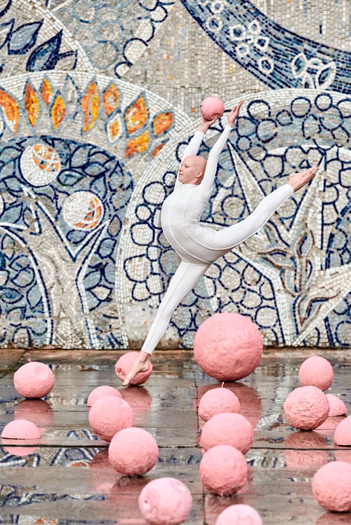 Preview: Young hairless girl ballerina with alopecia in white futuristic suit dancing outdoor and jumps