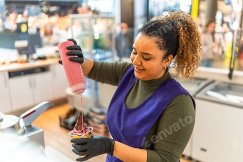 Preview: Woman working in food service preparing ice cream dessert