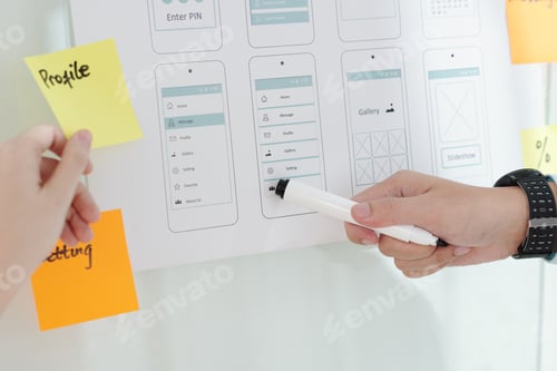 Preview: Designer Discussing Menu of Mobile App