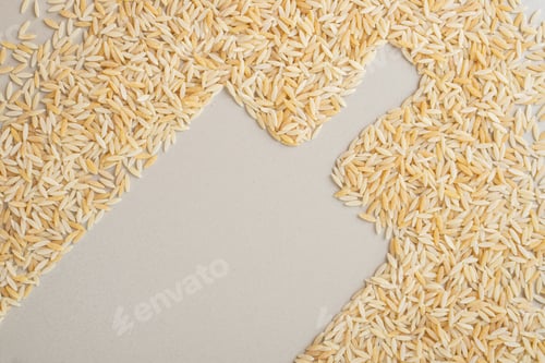 Preview: Yellow rice seeds isolated on concrete background