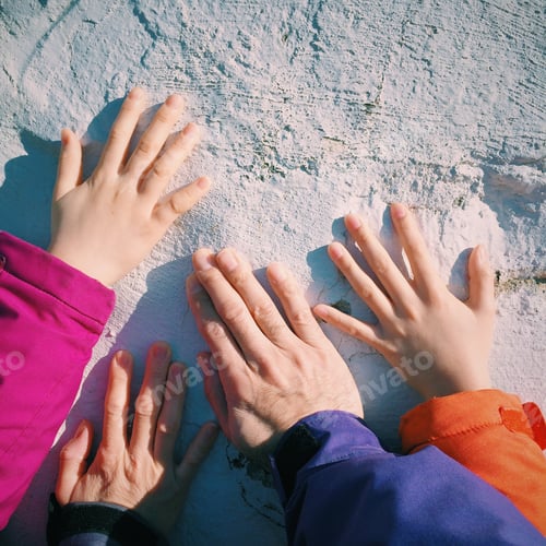 Preview: Family hands on a monument wall