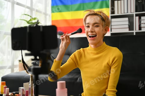 Preview: Young queer man beauty make up artist or vlogger recording makeup tutorial.
