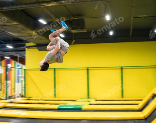 Preview: trampoline jumper performs acrobatic exercises on the trampoline