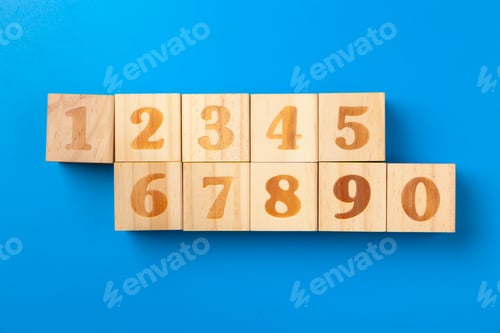 Preview: Numbers. Wooden colorful alphabet blocks on blue background, flat lay, top view