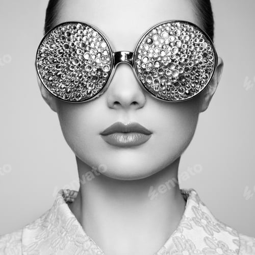 Preview: Portrait of beautiful young woman with colored glasses