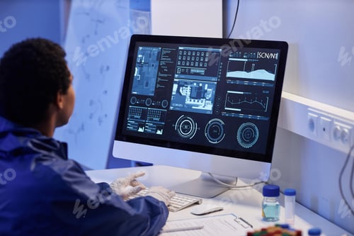 Preview: Worker using computer with scientific data in laboratory