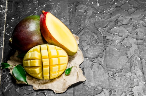 Preview: Fragrant ripe mango on a napkin.