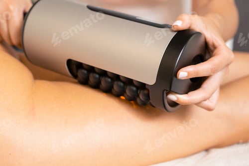 Preview: Close up massage therapist doing RSL sculpting treatment of woman legs