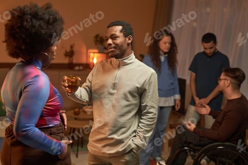 Preview: Black Man Holding Whiskey Glass during House Party