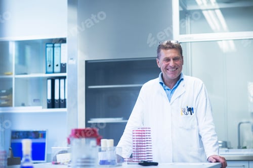 Preview: Happy scientist in laboratory