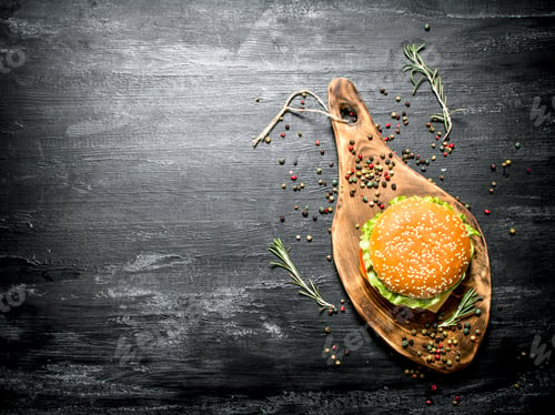 Preview: hamburger on a wooden Board. Top view.