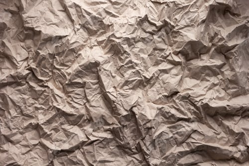 Preview: Parcel paper as background texture. Recycling concept with brown paper heap