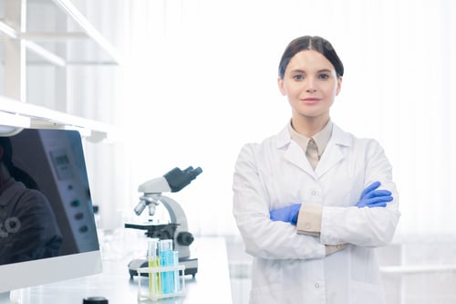 Woman in Lab Coat in Bright Lab Setting