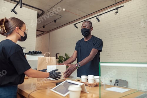 Preview: Employees in mask working together in pandemic