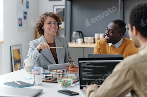 Preview: Team of developers working together at office