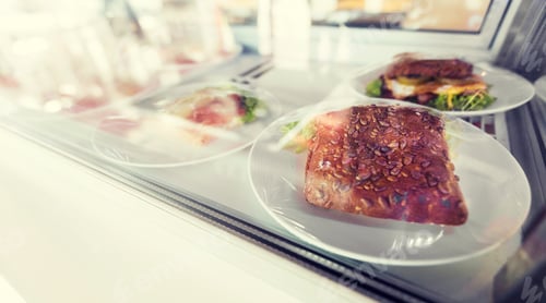Preview: close up of sandwich in cafe showcase or store