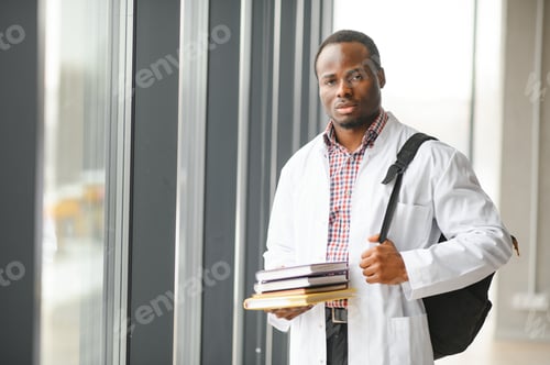 Preview: Healthcare Professional Holding Books in Hospital Setting
