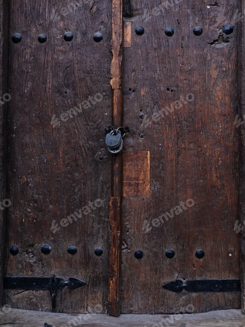 Preview: Textured wooden door with metal rivets