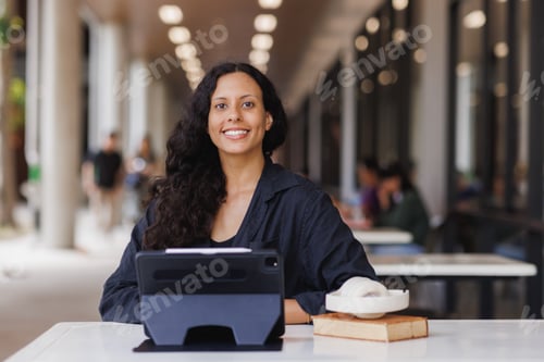 Preview: Young woman smiling working studying with technology outdoors