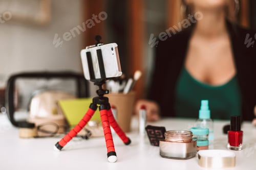 Preview: Close up beauty blogger recording new video on smartphone