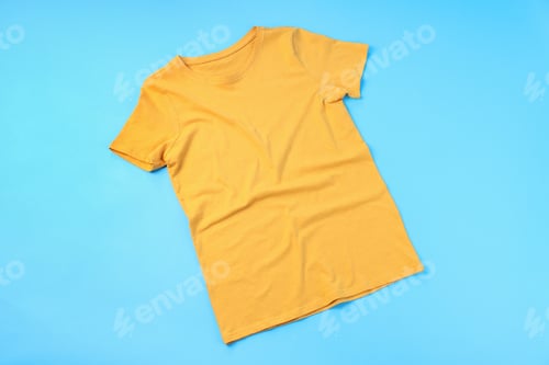 Preview: Blank yellow t-shirt with space for print on blue background