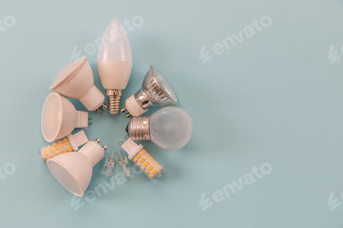 Preview: different types of light bulbs on a blue background. background for text