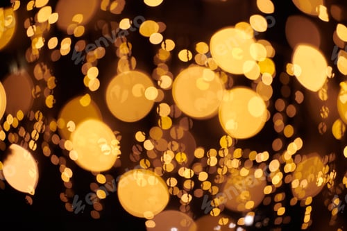 Preview: Yellow lights bokeh from christmas holiday garlands, blurred festive background, abstract lights
