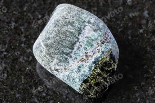Preview: polished richterite and diopside mineral on black