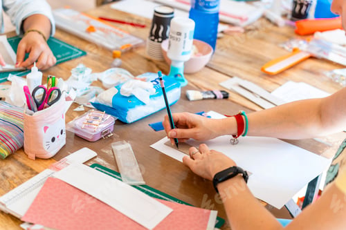 Preview: Scrapbook workshop. Woman drawing cutting patterns