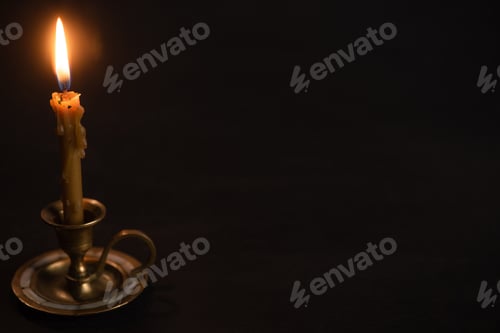 Preview: Church Candle in Candlestick Burning in Dark