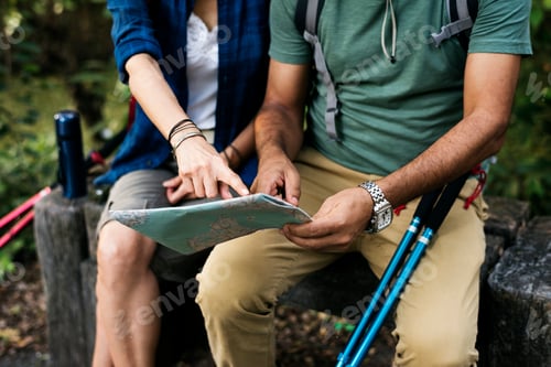 Preview: Couple finding directions using a map