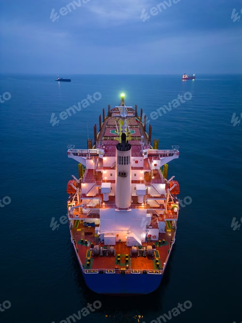 Preview: Aerial view cargo bulk carrier ship on the sea at night