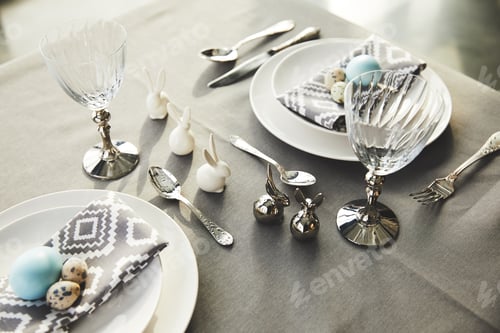 Preview: high angle view of easter rabbits and eggs on festive table