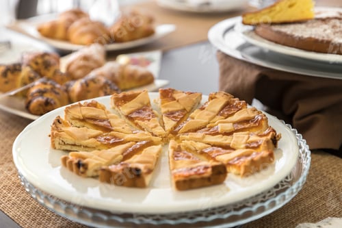 Preview: Breakfast buffet table with homemade cake and croissant
