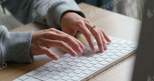 Preview: Woman type on desktop computer