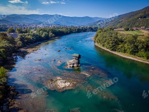 Preview: Aerial shot of a house in the middle of River Drina in Perucac, Bajina Basta, Serbia