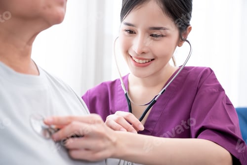 Preview: Young Woman Examines Patient With Stethoscope Indoors