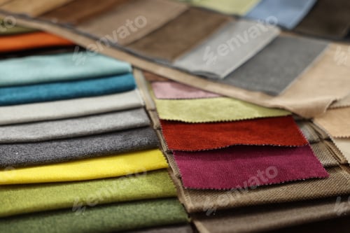 Preview: Samples of different fabrics as background, closeup