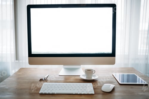 Preview: Office desk with computer, tablet and cup of coffee
