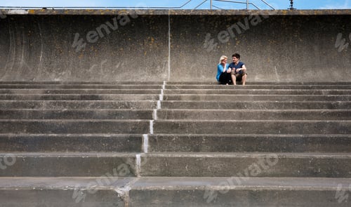 Preview: Couple sitting together on steps