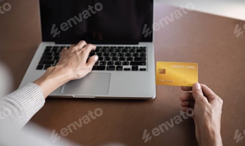 Preview: Woman Shopping Online with Laptop and Credit Card, Making Secure Purchases from Home, Modern E