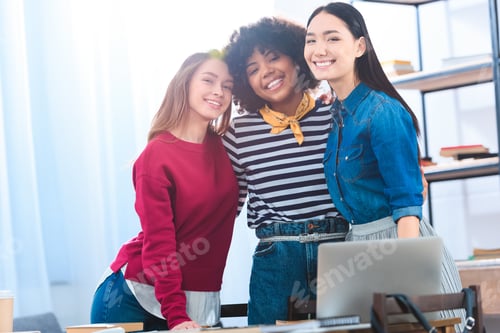Preview: portrait of pretty multiracial students looking at camera