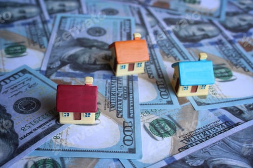 Preview: Selective focus image of toy house and money.