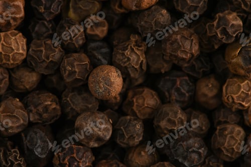 Preview: Black pepper peas super macro shot. Background of black peppercorn.