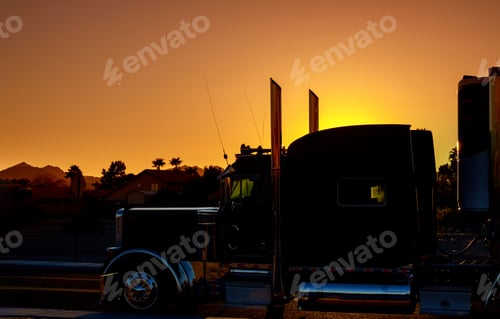 Preview: Truck on highway road with transporting on the asphalt expressway against sky during sunset