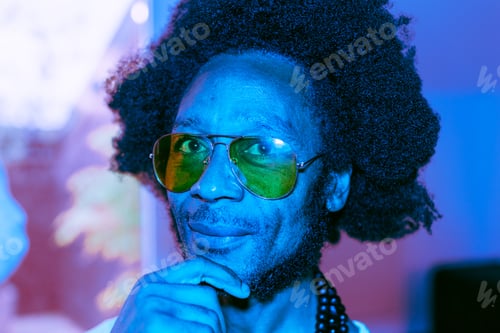 Preview: portrait in blue neon light of an african american brazilian man