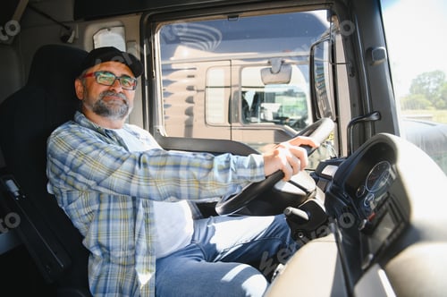 Preview: Truck Driver at the Wheel Inside Vehicle