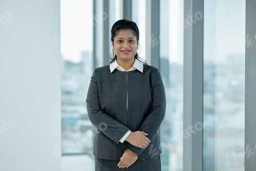 Preview: Confident Businesswoman In Suit In Office